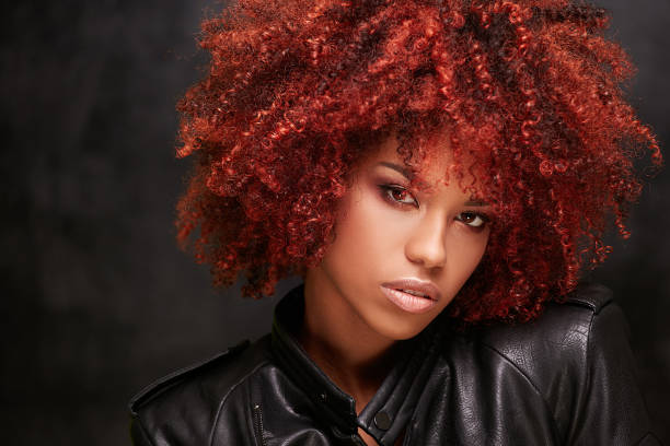 Woman with vibrant red curly hair